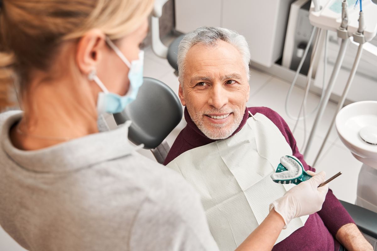 Custom dentures and partial dentures fitted at Devoted Dental Group Metro Detroit, with flexible payment plans and Medicaid accepted