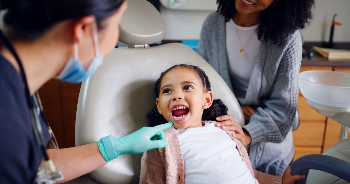 Family-friendly dental exam for children at Devoted Dental Group, offering comprehensive cleaning and exams for all ages, Medicaid accepted