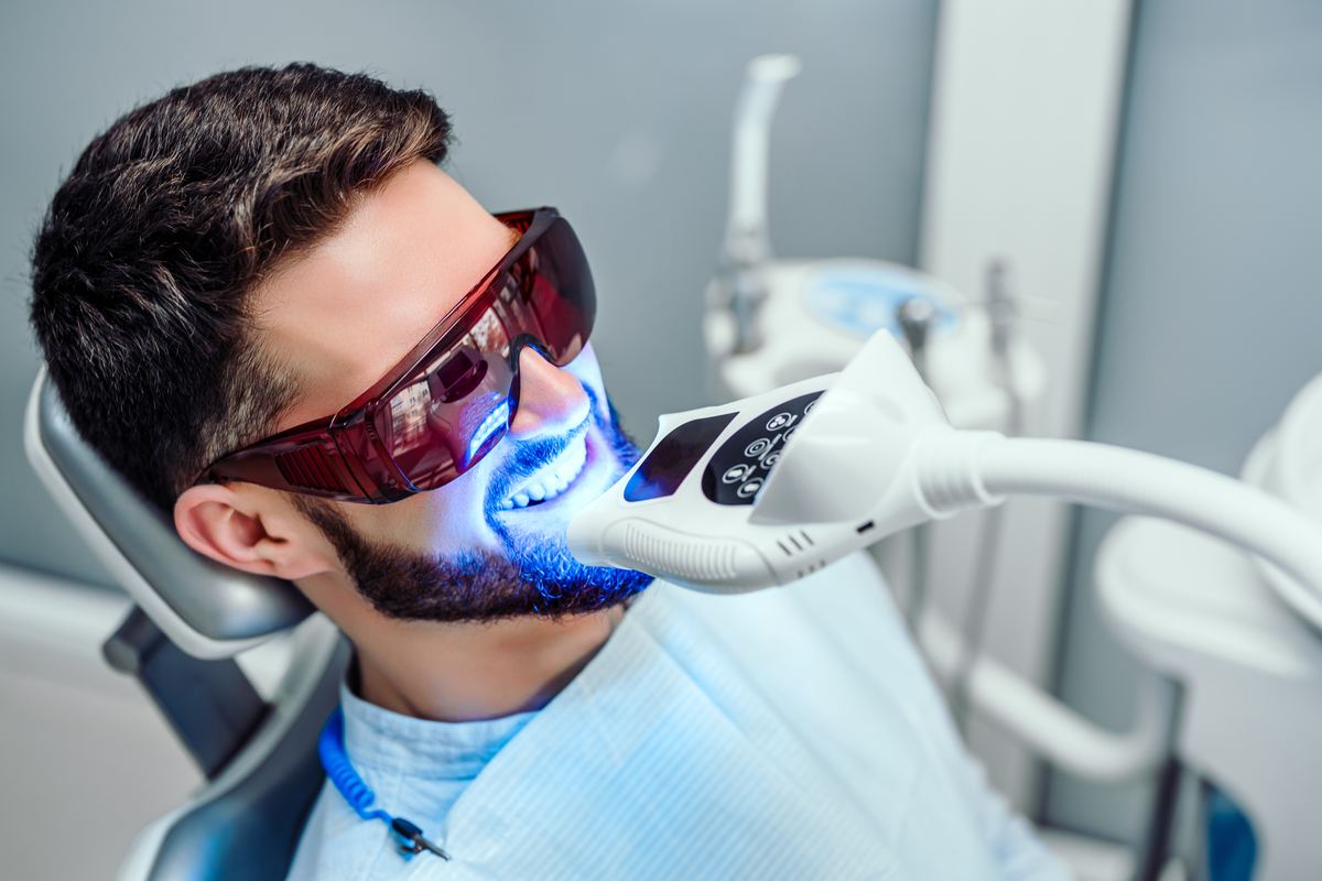 Professional teeth whitening treatment at Devoted Dental Group Metro Detroit with dramatic same-visit results