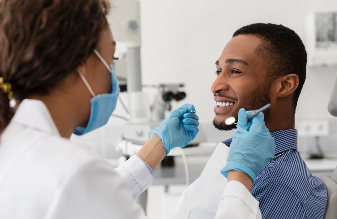 Relaxed patient smiling during comfortable dental exam at Devoted Dental Group